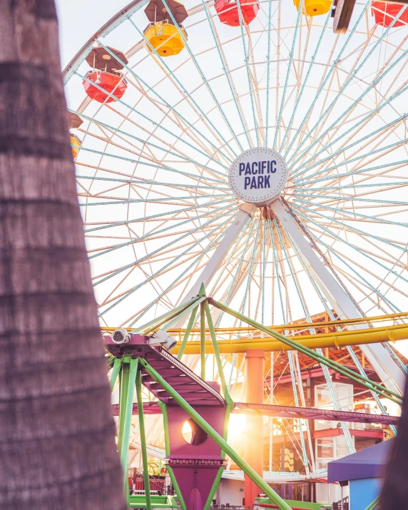 there is a ferris wheel that has a sign on it