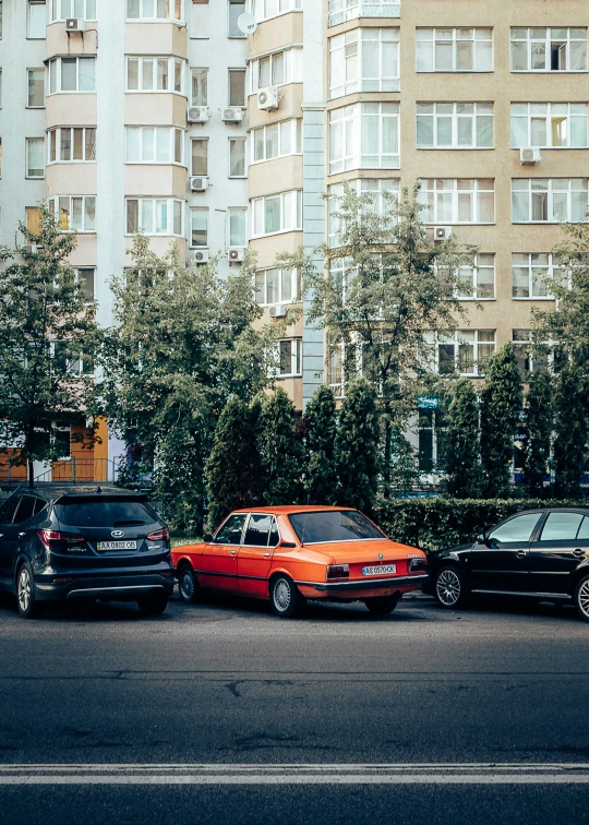 a line of cars and a car truck on the street