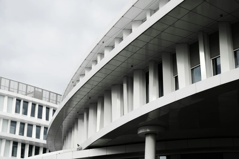 a large white building with lots of windows on it's sides