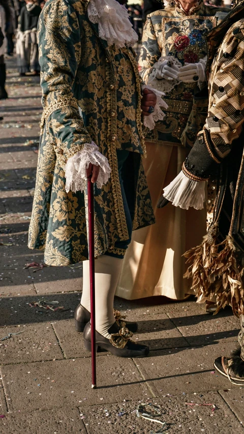 the man is standing next to the old woman