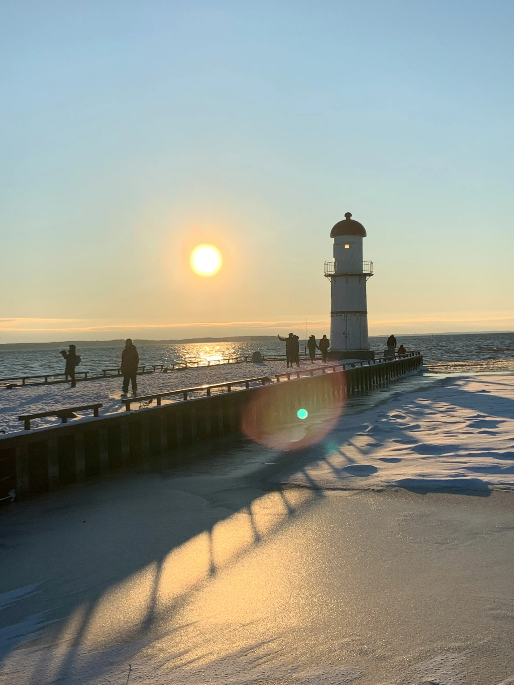 a light house on a shore near a body of water