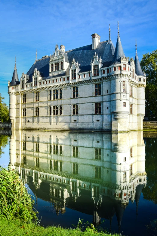 a palace sitting on top of a lush green hillside