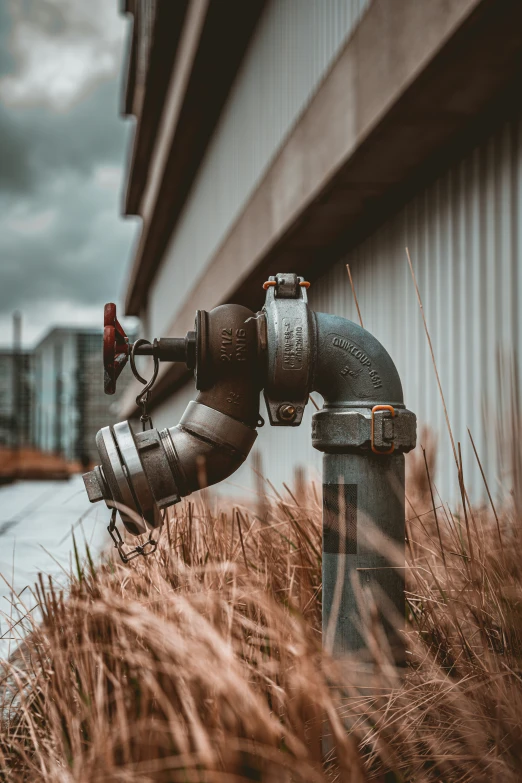 an old fashioned fire hydrant in front of a building