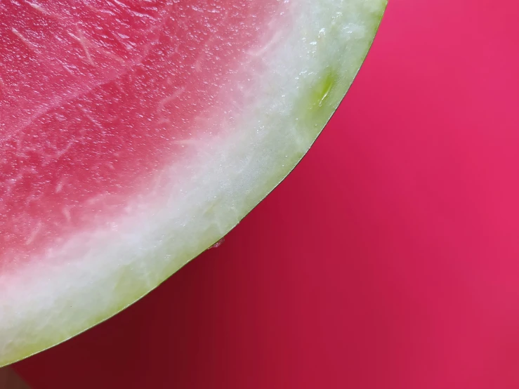 a close up view of watermelon on a red background