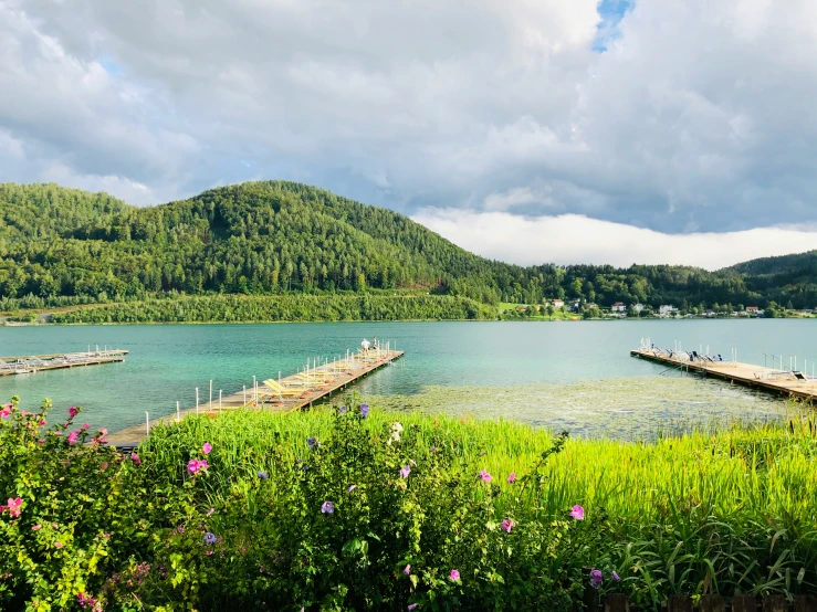 there is a dock in the water by a pier