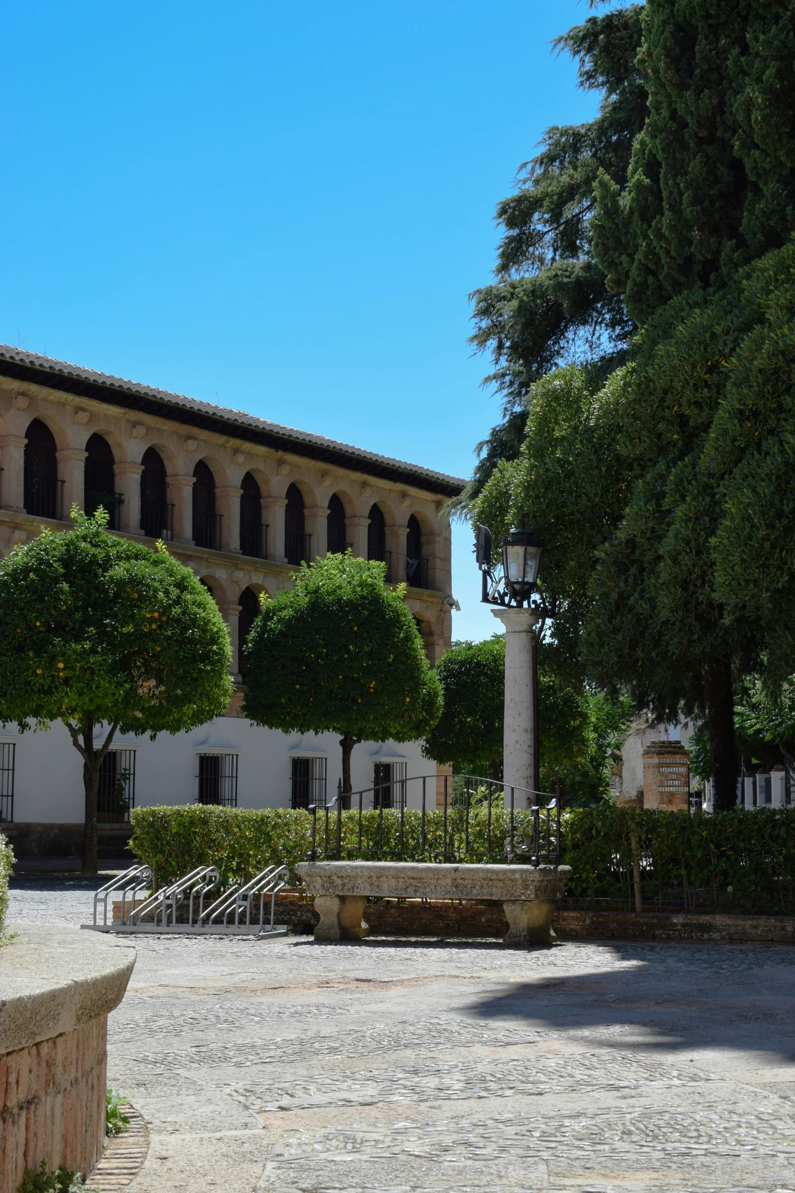 a white building with columns and pillars around it