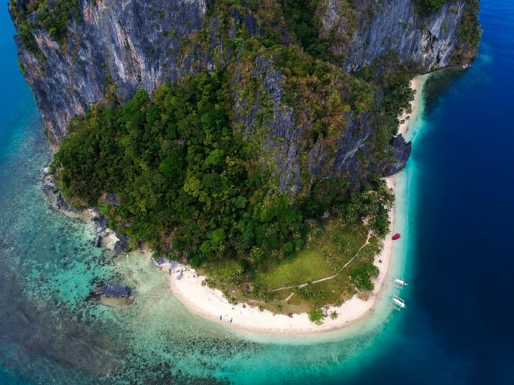 an island with lots of sand surrounded by water