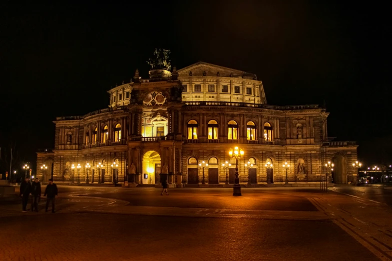 a picture of a city hall during the night time