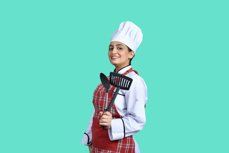 a woman with an apron is holding a spatula