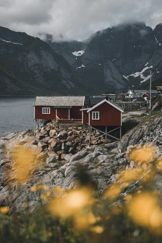 there are three red buildings near the water