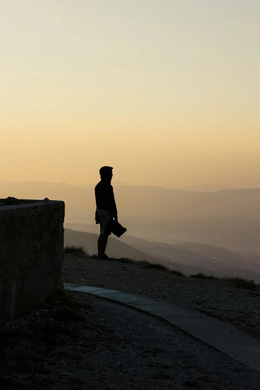 a person is standing on top of a hill