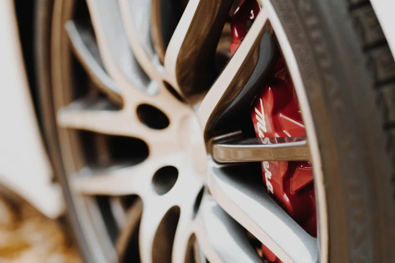 a wheel and rim of a sports car with it's ke stickers extended