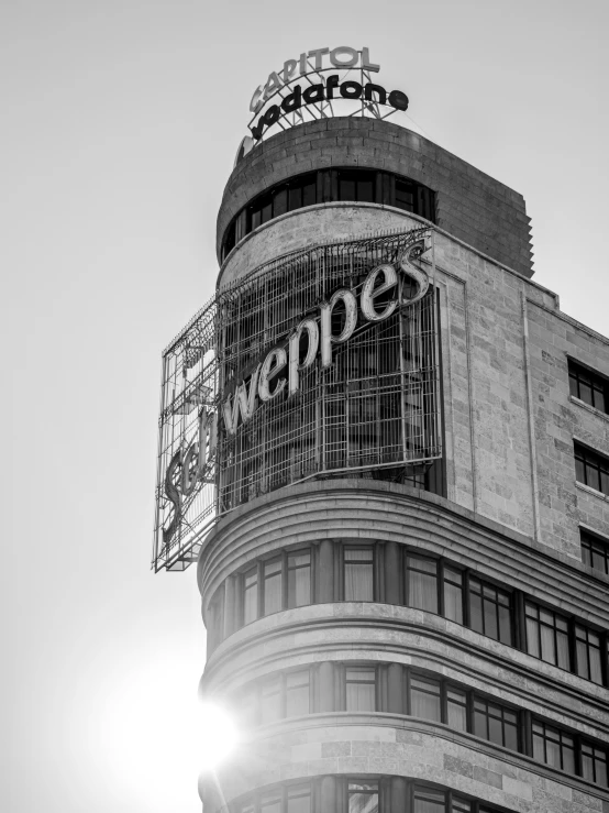 an office building with sign above the front