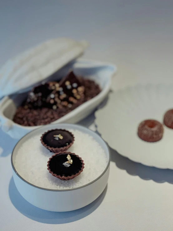 a small round container with cookies in it