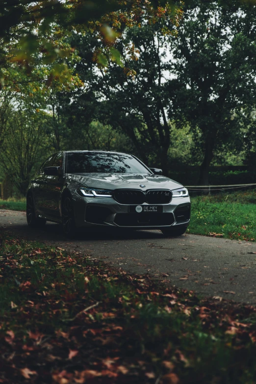 a black car is parked on the side of the road