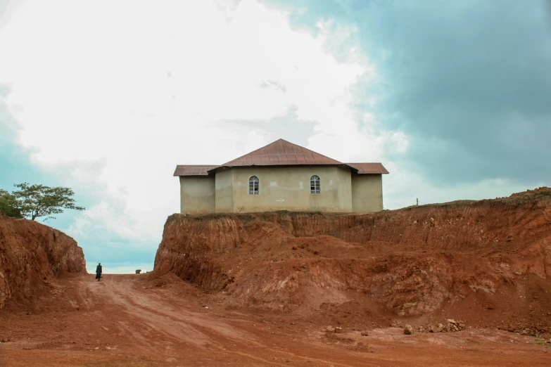 the corner house on the hill is on top of a large hill