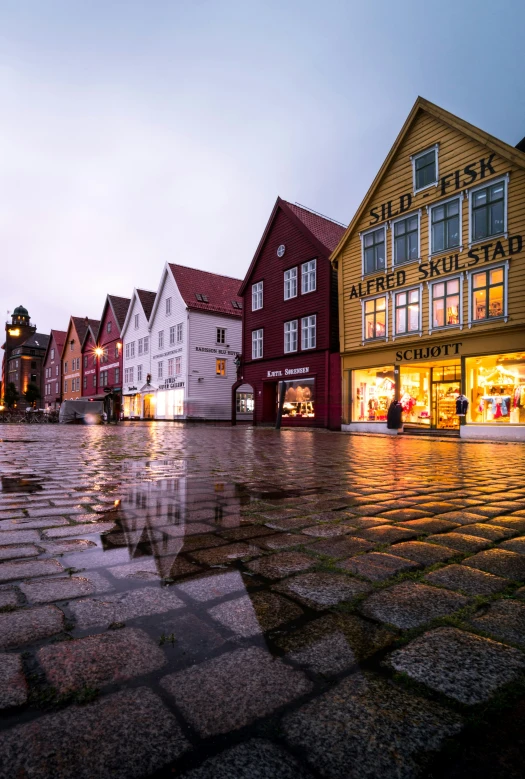 a street with buildings on the other side of the road