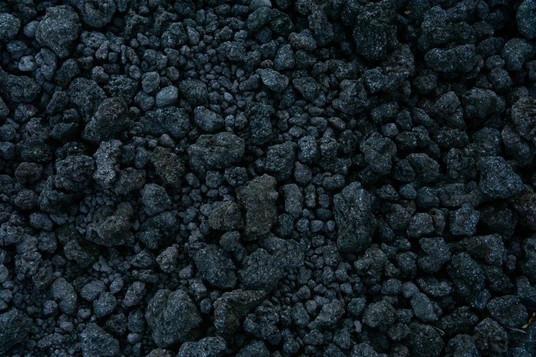 a black rocks background that looks like soing