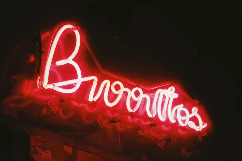 a red neon sign that says broccolites on it