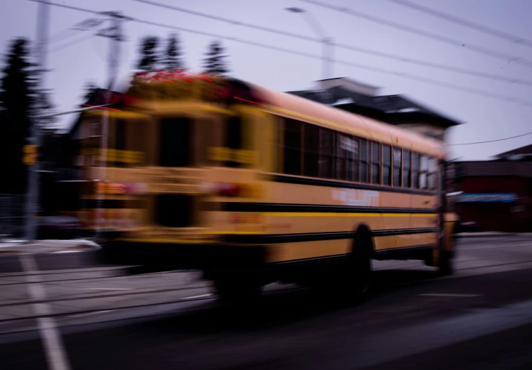 a school bus on a street with power lines overhead