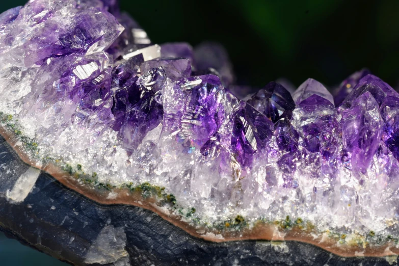 there is purple crystals that are laying down on the table