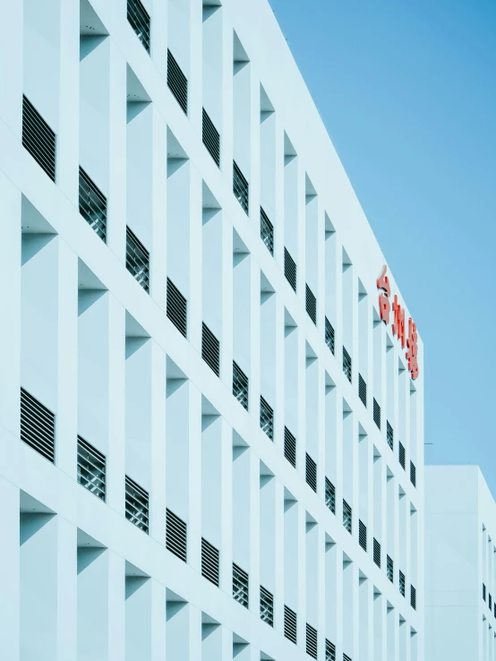 a very large white building with some balconies on it