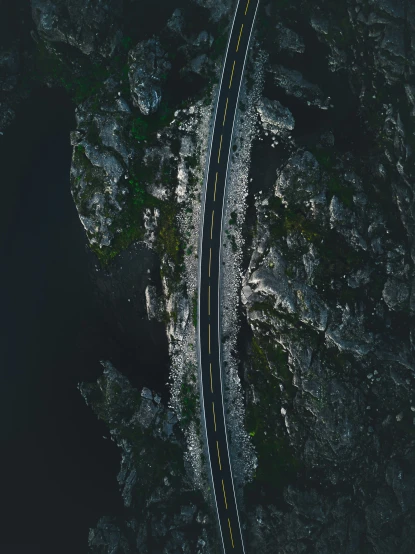 the aerial view of two road curves in one area