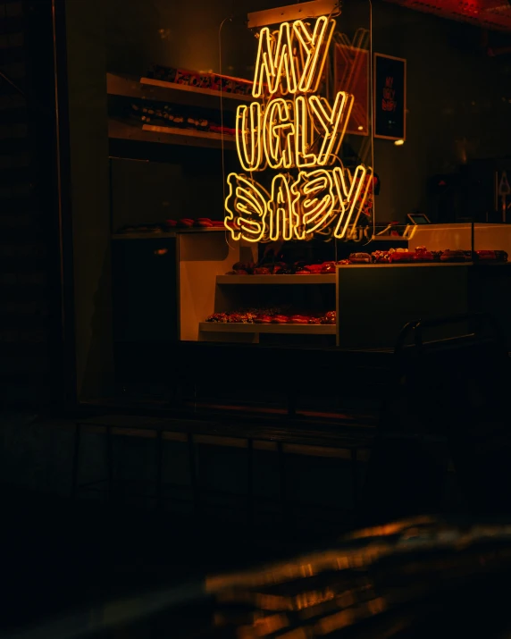 a neon sign advertising a store with an upside down light