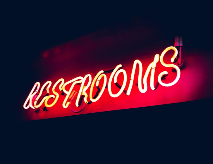 a neon sign that reads k s r ooms
