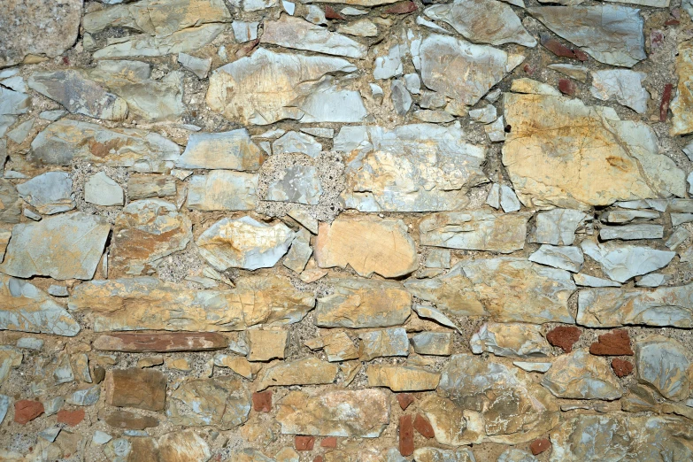 the wall is made of a variety of small stones