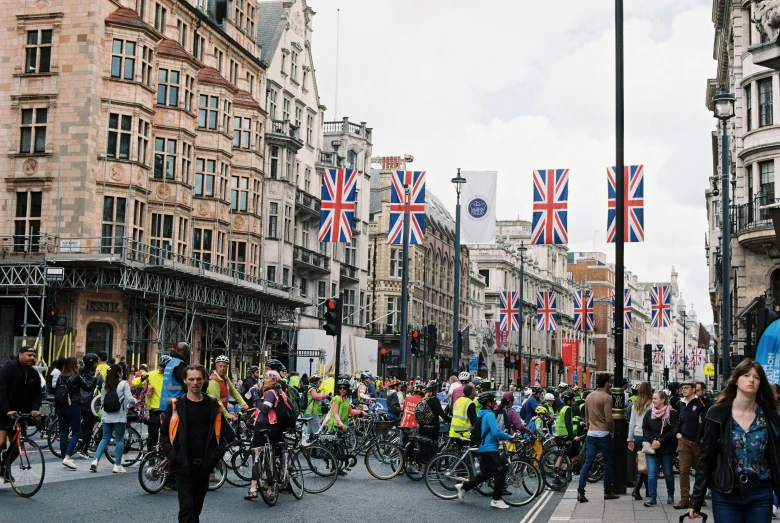 the people are riding bicycles on the street