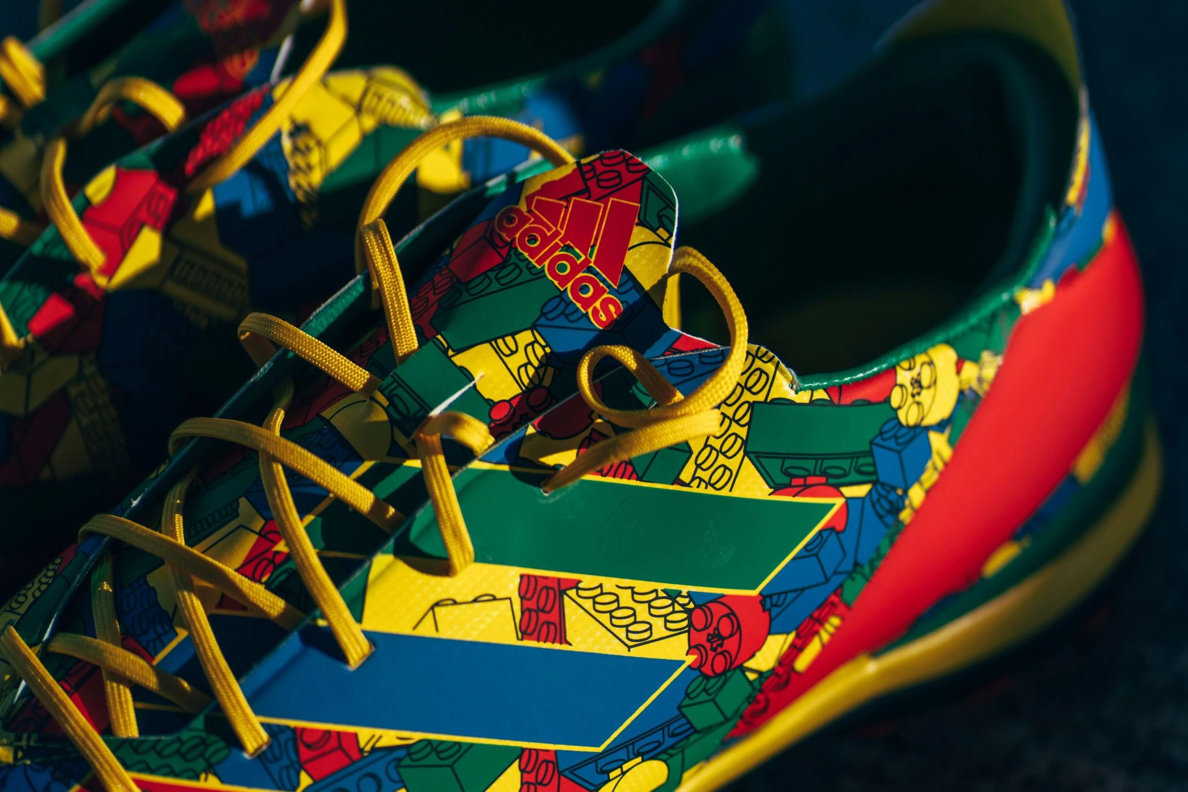 a colorful tennis shoe on a dark surface