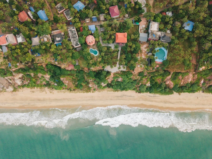 an aerial view of a beach front cottage