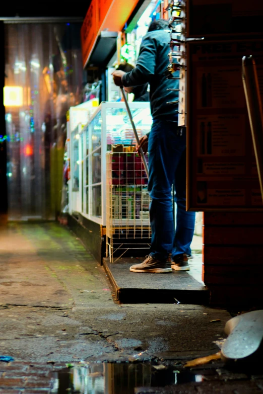 a man is leaning against the back of a truck