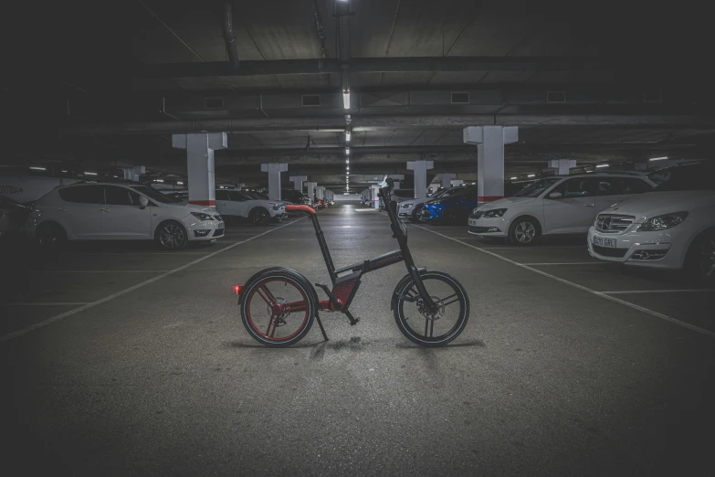 an abandoned bicycle in an underground parking garage