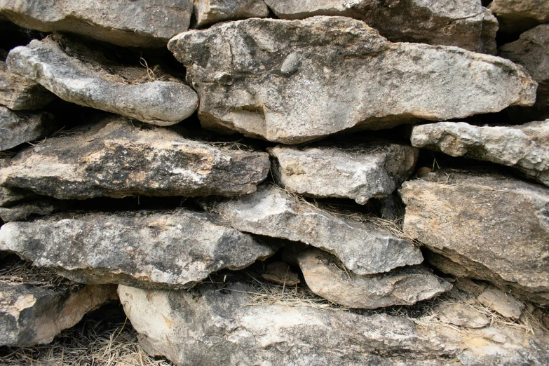 some grey rocks stacked together by each other