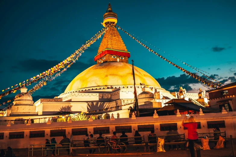 a domed golden building with lots of lights on it