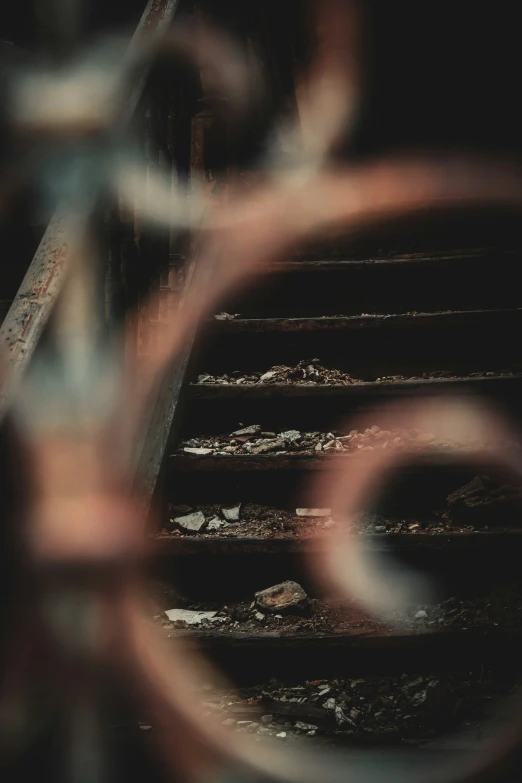 a blurry pograph of steps through metal bars