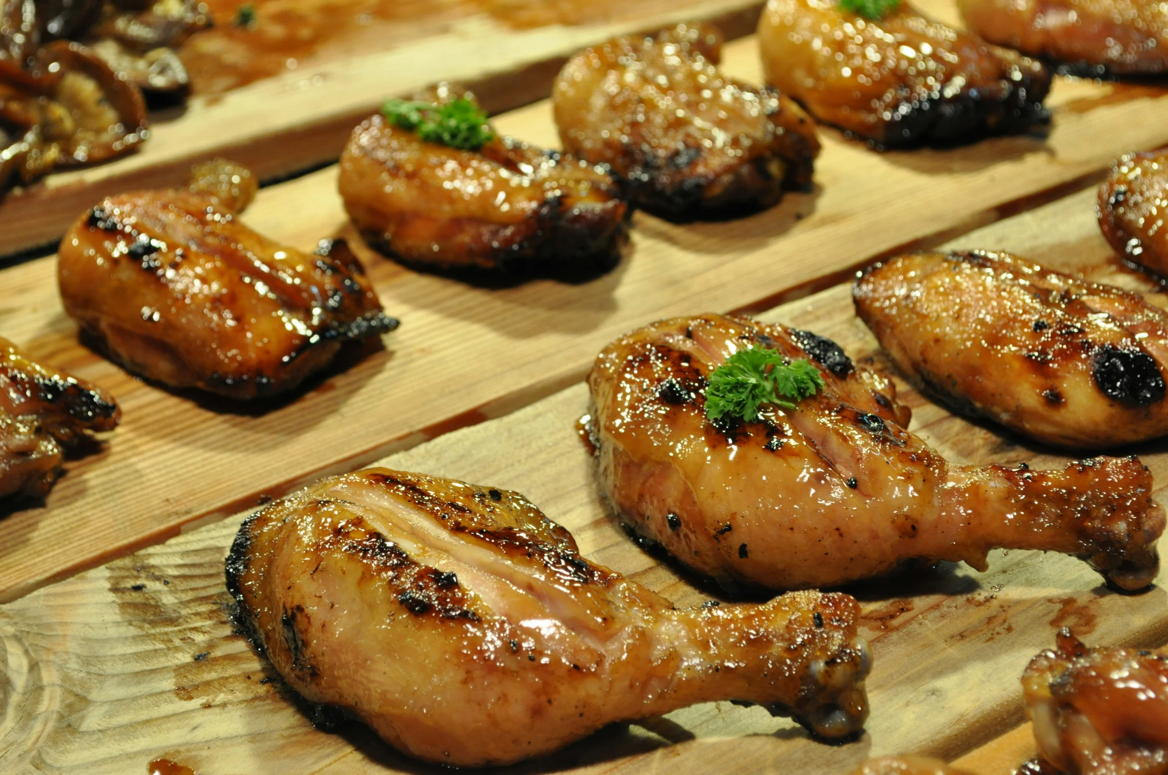 grilled meats that are on a wooden surface