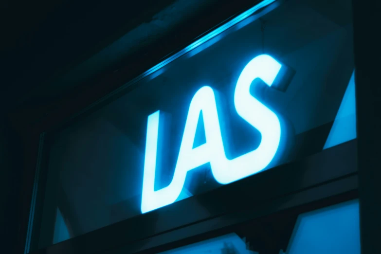 a neon sign that reads las above the word las