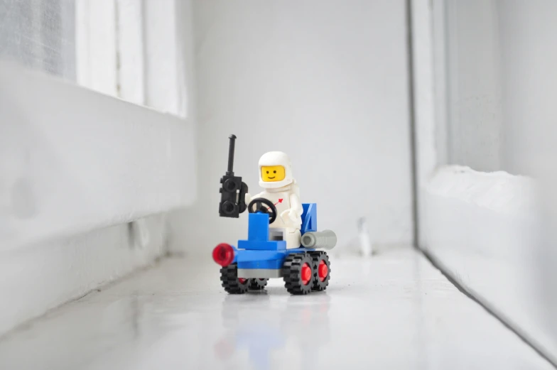 a toy truck with a lego figure on it