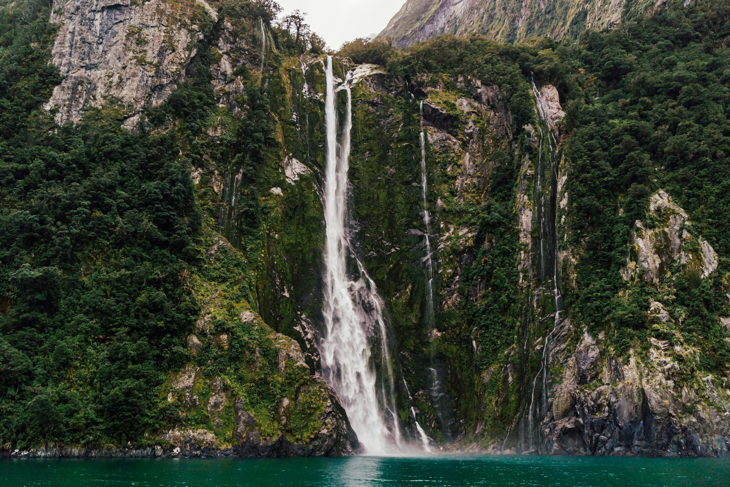 water fall coming from the base of a waterfall