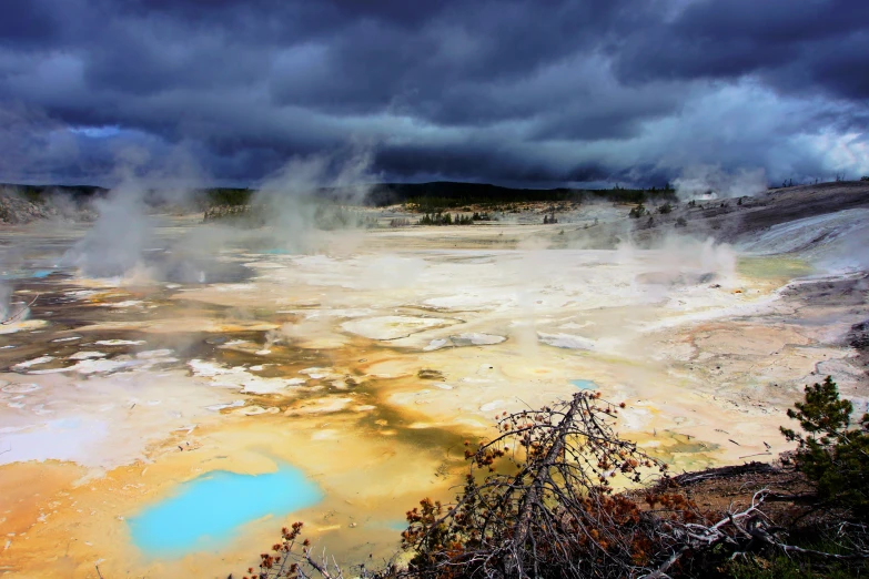 some steam is spewing out water near the ground