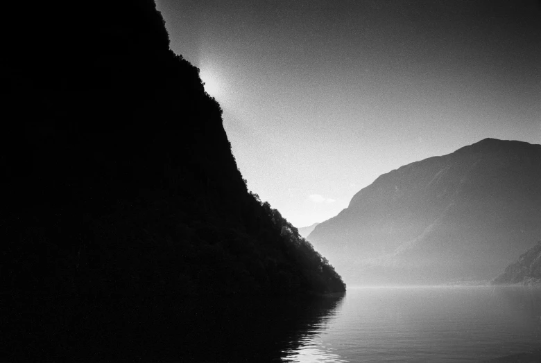 water and a mountain are in the distance