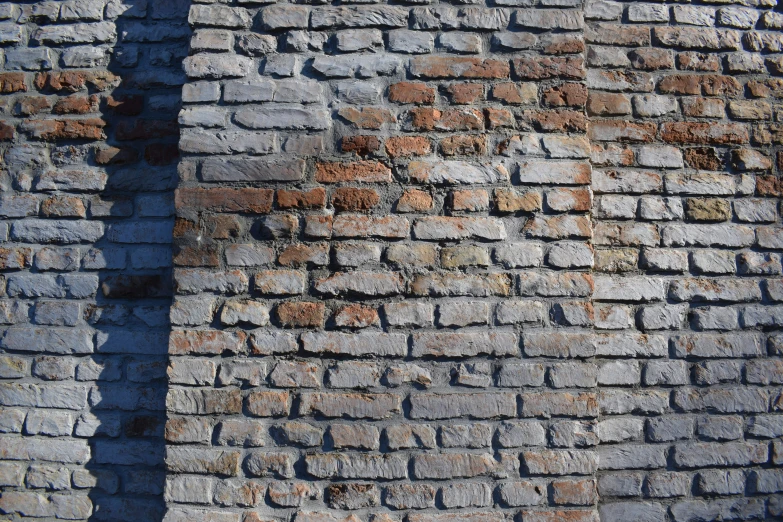 the wall of a building has two bricks on it