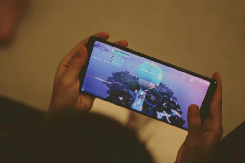 a person playing the game with their phone
