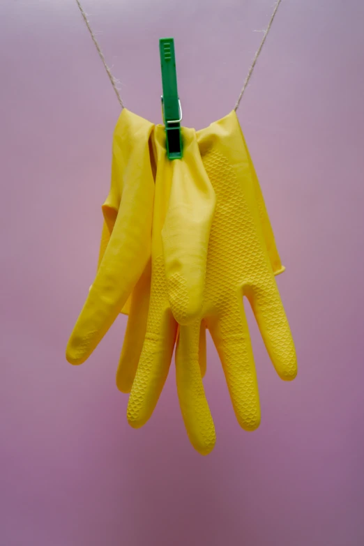 rubber gloves hanging on a clothesline
