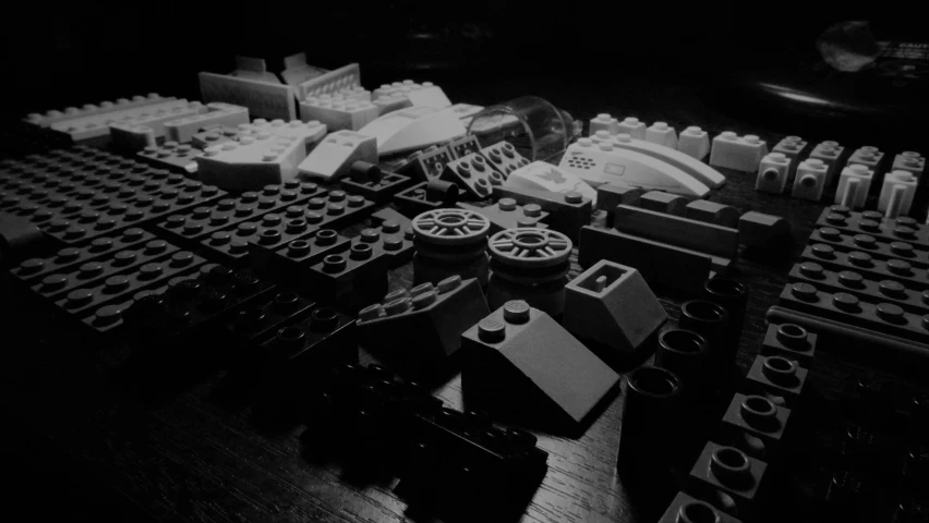 a group of legos sitting on top of a wooden table