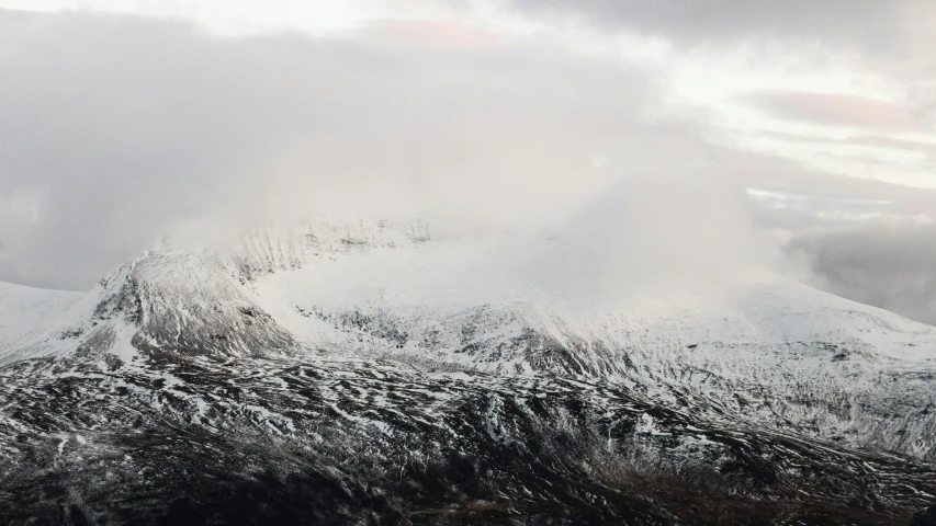 a mountain covered in snow during the winter