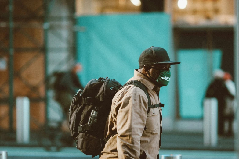 a man with his backpack standing by himself